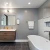 Designer,Bathroom,With,Glass,Shower,And,Wooden,Cabinet